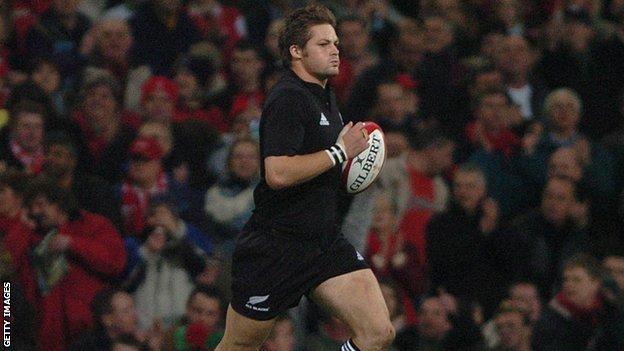 Richie McCaw leads out New Zealand for the first time against Wales in 2004