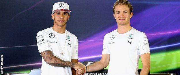 Lewis Hamilton and Nico Rosberg shake hands at the Abu Dhabi Grand Prix