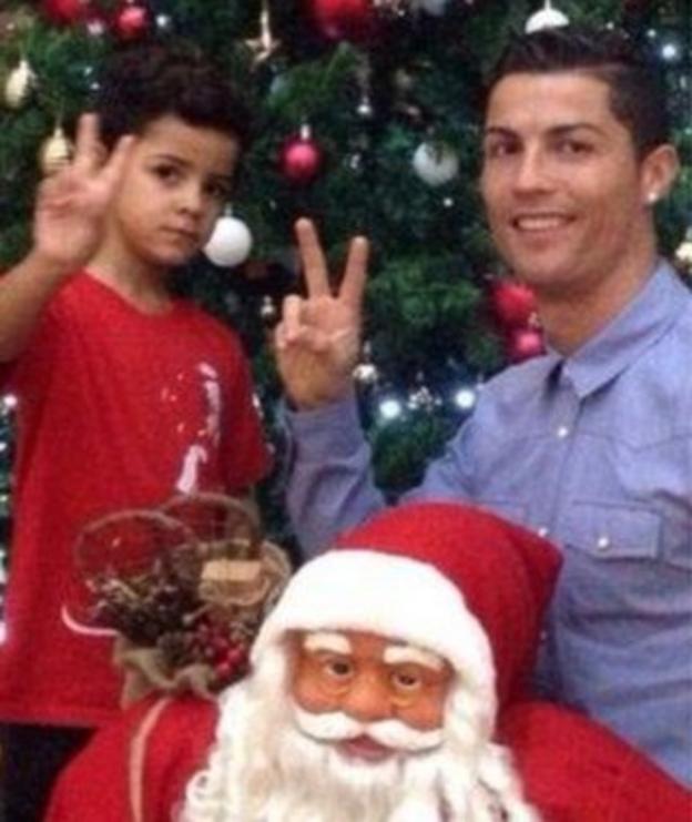 Cristiano Ronaldo poses with his son