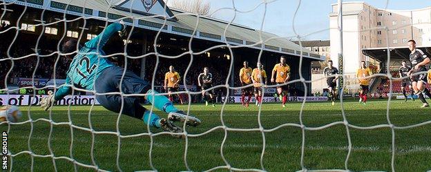 Paul Gallacher went the right way but could not reach Adam Rooney's firmly struck penalty