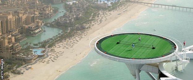 Roger Federer and Andre Agassi play tennis on the helipad of the Burj Al Arab hotel