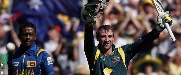 Australia"s Phillip Hughes celebrates reaching his century as Sri Lanka"s Jeevan Mendis (L) looks on during the one-day international cricket match at the Melbourne Cricket Ground in this January 11, 2013 file photo