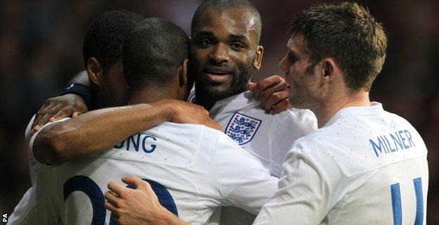 England's Darren Bent (centre) celebrates with team mates Glen Johnson (left), Ashley Young (2nd left) and James Milner