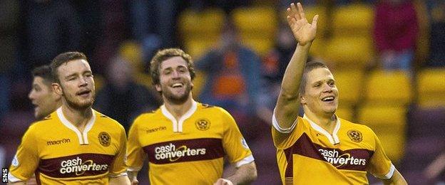 Henrik Ojamaa waves to the home fans after scoring for Motherwell