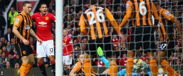 Manchester United defender Chris Smalling watches as Allan McGregor fails to keep out his shot
