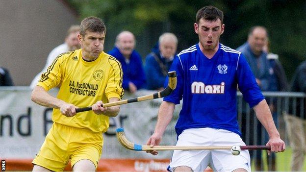 Zac Coley (right) holds off Inveraray's Ruaraidh Graham in the Celtic Society Cup final in June
