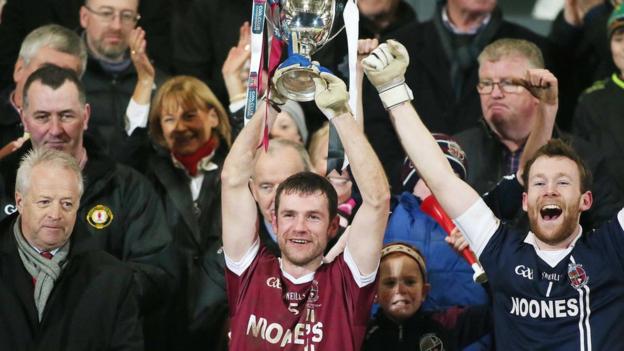 Slaughtneil skipper Francis McEldowney lifts the Seamus McFerran Cup after his side's one-point win over Omagh club St Enda's