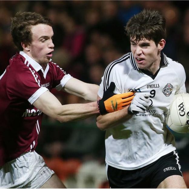 Padraig Cassidy of Slaughtneil gets to grips with Omagh's Conan Grugan during the big match at the Athletic Grounds