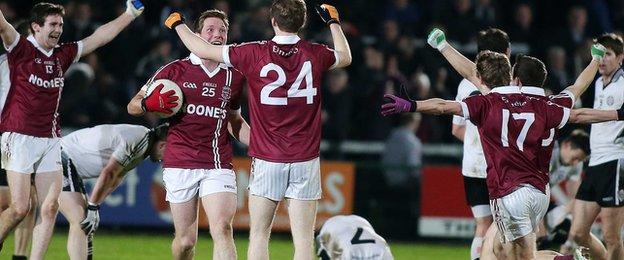 The Slaughtneil players celebrate after the final at the Athletic Grounds