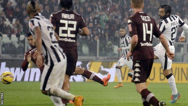 Andrea Pirlo scores Juventus' late winner in the derby against Torino