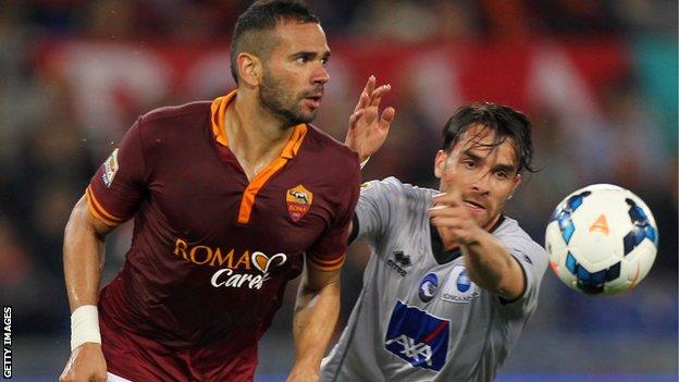 Roma defender Leandro Castan competes for the ball against Atalanta