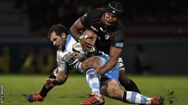 Toulouse flanker Thierry Dusautoir (top) vies with Glasgow Warriors hooker Fraser Brown