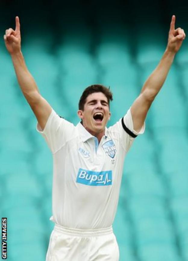 Sean Abbott celebrates taking a wicket on his return for New South Wales