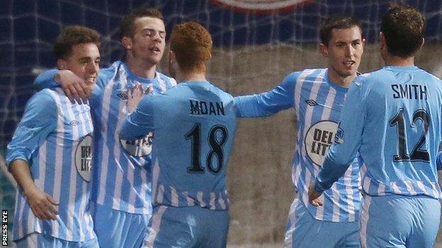 Warrenpoint's players celebrated a famous victory over leaders Portadown