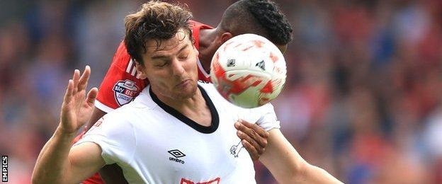 Derby County's Chris Martin battles for possession with Nottingham Forest's Michael Mancienne