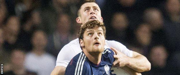 Scotland's Chris Martin in action against England's Gary Cahill