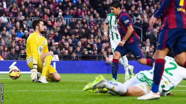 Barcelona striker Luis Suarez scores against Cordoba