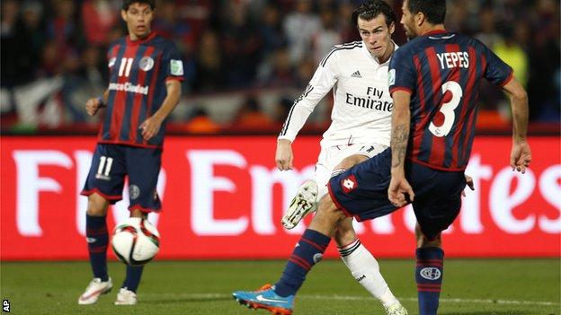 Real Madrid forward Gareth Bale scores for his side against San Lorenzo
