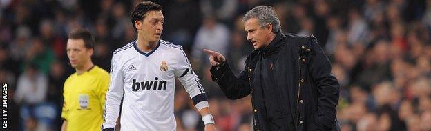 Jose Mourinho talks with Mesut Ozil