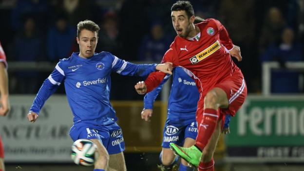 Ballinamallard's Colm McLoughlin can only watch as Cliftonville striker Joe Gormley fires in a shot during Tuesday night's clash at Ferney Park