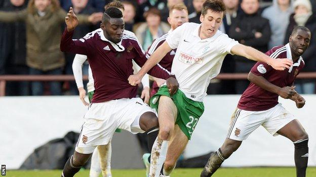 Hearts' Prince Buaben and Callum Booth battle for the ball during the Edinburgh derby