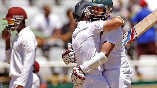 South African Dean Elgar, left, reacts with Hashim Amla
