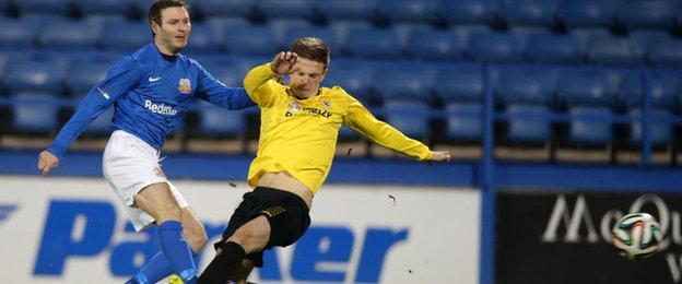 Kevin Braniff strokes home Glenavon's second goal in the rearranged league game