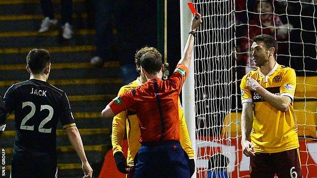Motherwell's Stephen McManus protests his innocence to referee Willie Collum