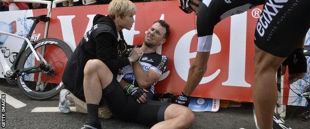 Mark Cavendish injured receives medical assistance after a fall near the finish line at the first stage of the Tour de France in 2014