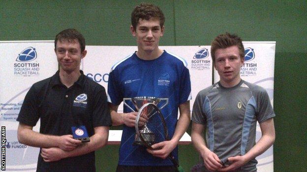 Rory Stewart poses with the Scottish Junior Squash Under-19 trophy