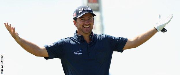 Graeme McDowell of Ireland celebrates after making his second shot on the 9th hole during day one of the World Cup of Golf at Royal Melbourne Golf Course
