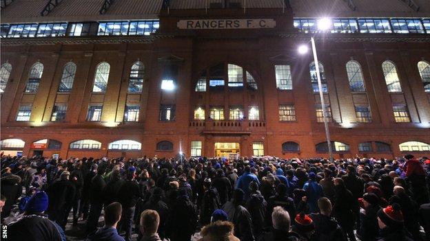 Fans outside the main door at Ibrox