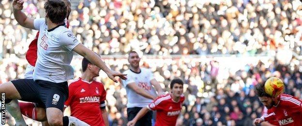 Nottingham Forest's Henri Lansbury heads in to his own goal to give Derby County the lead