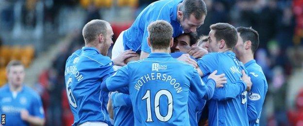 Dave Mackay (centre) is mobbed by his teammates after giving St Johnstone the lead