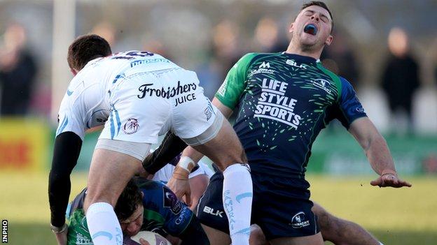 Robbie Henshaw grimaces after hurting his ankle in Connacht's defeat by Exeter