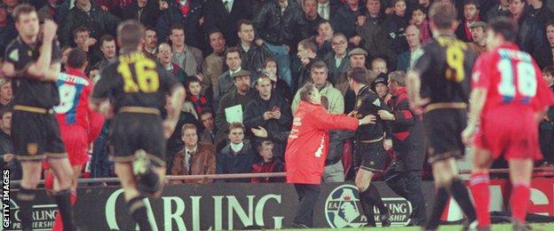 United defender Gary Pallister (far left) looks dazed as Roy Keane (16) runs towards Eric Cantona