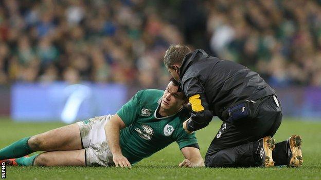 Jonathan Sexton gets treatment after being concussed in Ireland's game against Australia in late November