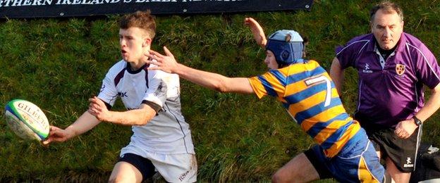 RS Armagh's Michael Murugasu is closed down by Ross Neill in the 19-10 win over Belfast High