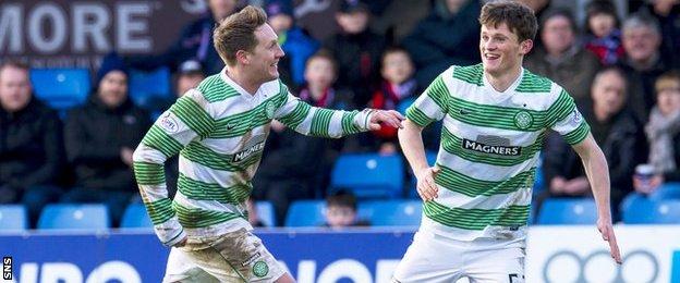 Celtic players Kris Commons and Liam Henderson celebrate
