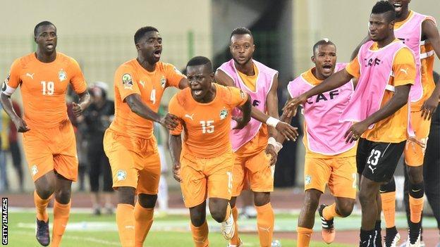 Max Gradel (centre) celebrates scoring Ivory Coast's equaliser
