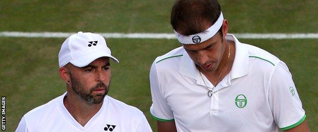 Jamie Delgado and Gilles Muller playing at Wimbledon