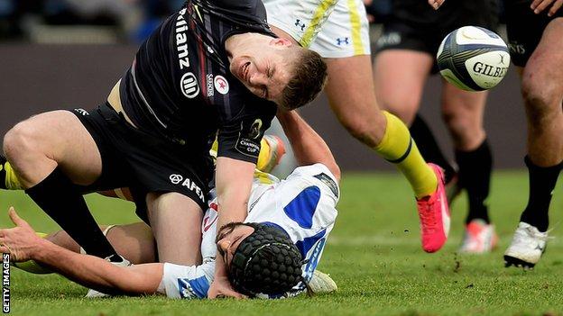 Owen Farrell is injured in a tackle by Clermont's Portugal flanker Julien Bardy