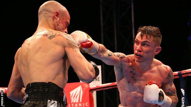 Kiko Martinez takes another punch from Carl Frampton in the world title fight in September