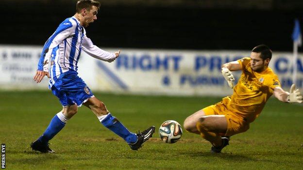 Coleraine's Ian Parkhill and Glenavon goalkeeper James McGrath