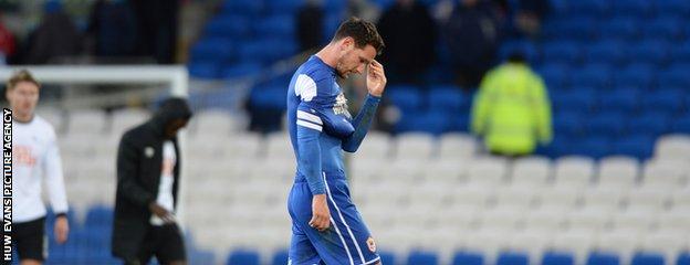 Cardiff City defender Sean Morrison walks off the field dejected after the 2-0 home defeat against Derby