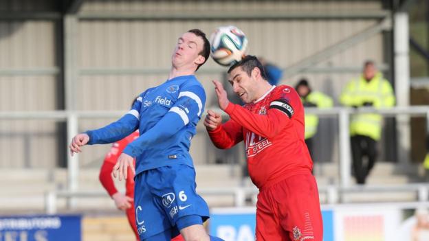 Ballinamallard's David Kee in aerial action against Portadown defender Keith O'Hara during the 0-0 stalemate