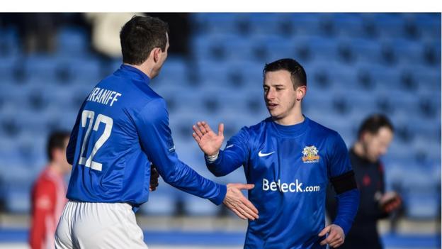 Kevin Braniff congratulates fellow Glenavon goalscorer after the latter scored an equaliser at Mourneview Park