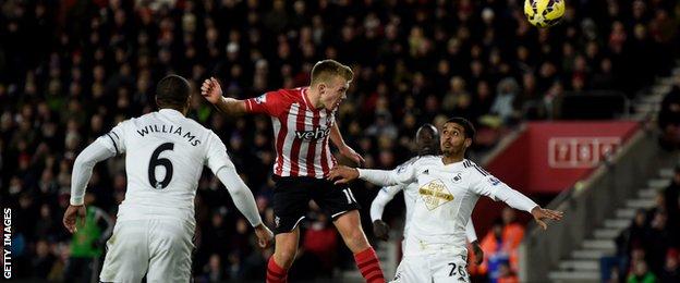 James Ward-Prowse of Southampton rises above Kyle Naughton of Swansea City