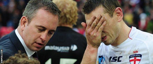 A dejected Kevin Sinfield with England coach Steve McNamara