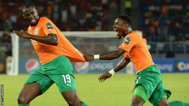 Yaya Toure and Serge Aurier celebrate the Ivory Coast's first goal against DR Congo